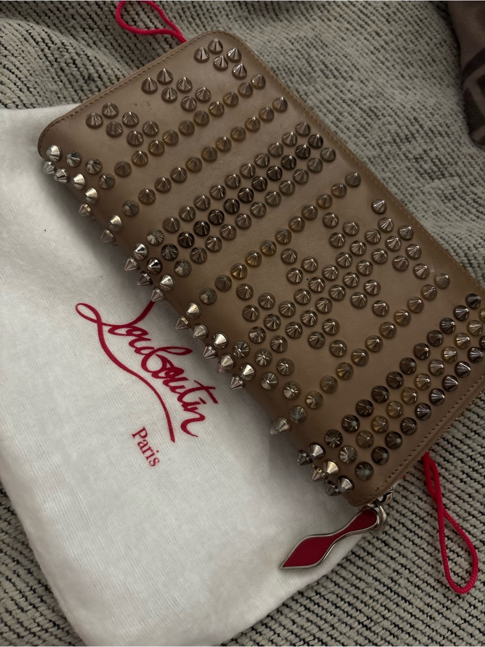 Christian Louboutin Beige Spike Zip Around Wallet with Red Pull